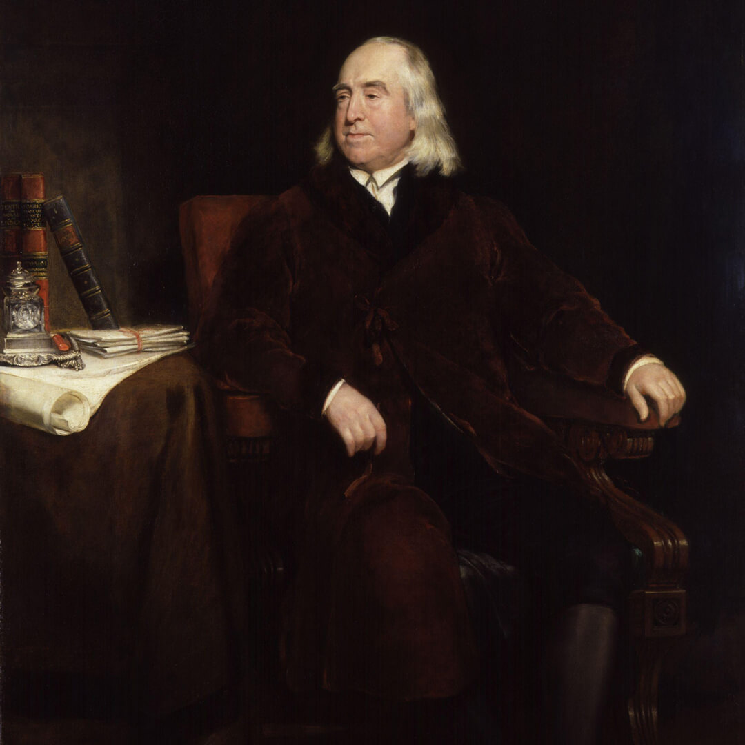 A painting of Jeremy Bentham, a man in a brown coat, seated in a chair, reflecting his philosophical demeanor.
